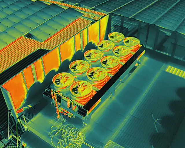 Thermal view of a condenser bank beside a warm roof wall
